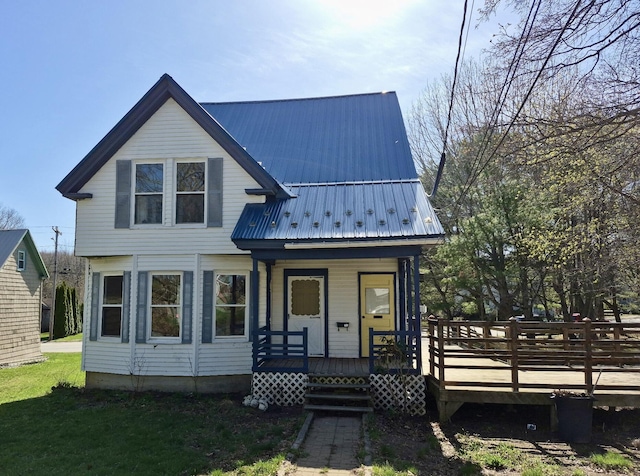 view of front of house featuring covered porch and metal roof