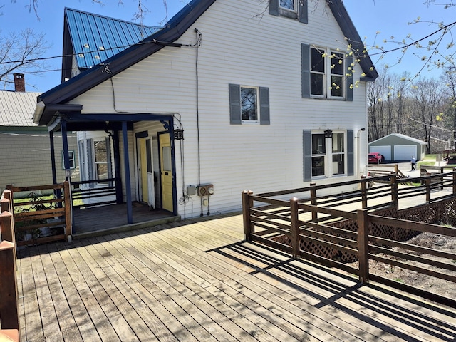 wooden deck with an outbuilding