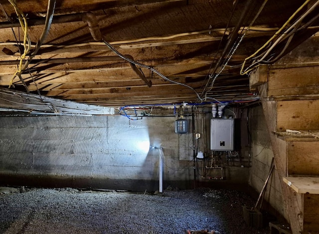 unfinished basement featuring water heater