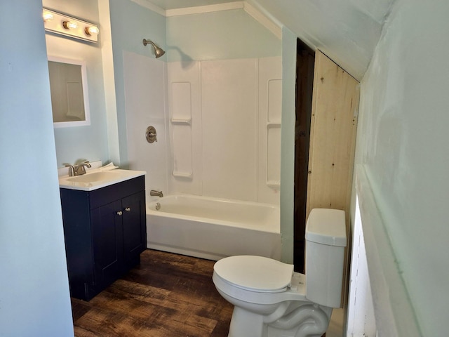 full bathroom with shower / bathtub combination, toilet, wood finished floors, and vanity