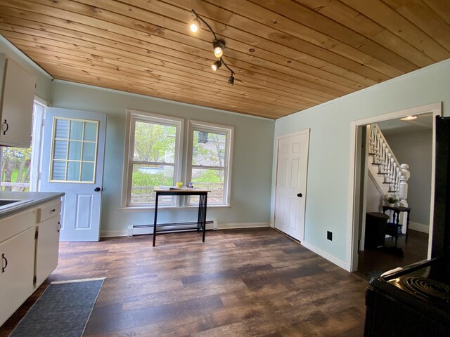 dining space featuring baseboard heating, wood ceiling, stairs, dark wood-style floors, and baseboards