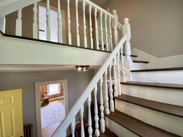 stairs featuring vaulted ceiling