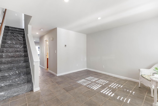 interior space featuring tile patterned flooring, stairway, recessed lighting, and baseboards