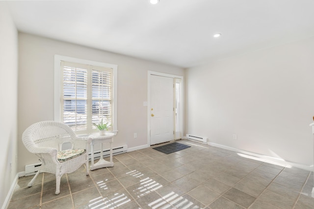 tiled entrance foyer with recessed lighting, baseboards, and a baseboard radiator