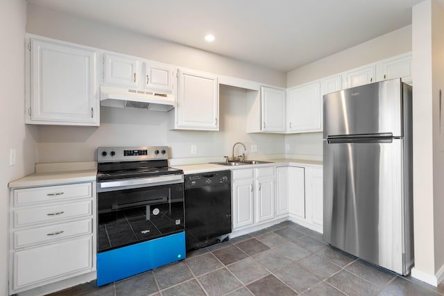 kitchen with under cabinet range hood, light countertops, appliances with stainless steel finishes, white cabinetry, and a sink