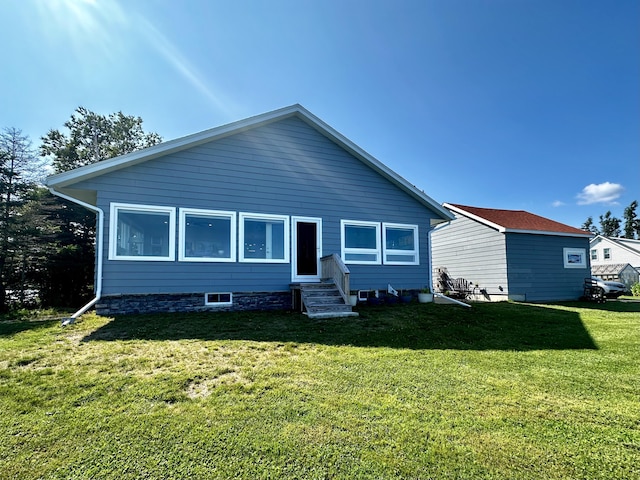 68 Robbins St, Robbinston, ME 04671 - back of property featuring entry steps and a lawn