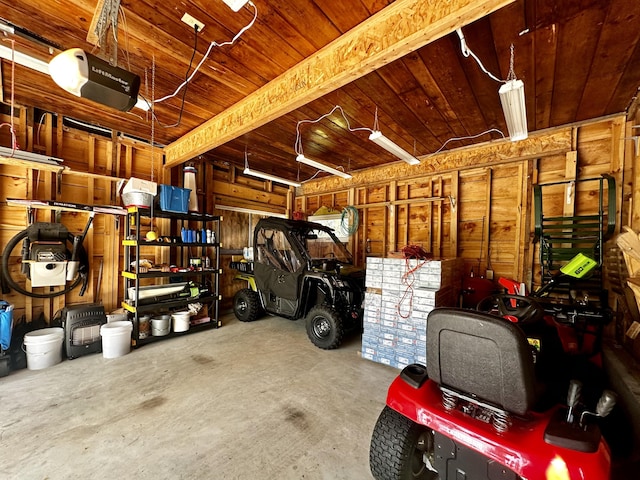 68 Robbins St, Robbinston, ME 04671 - garage featuring wood ceiling and a garage door opener