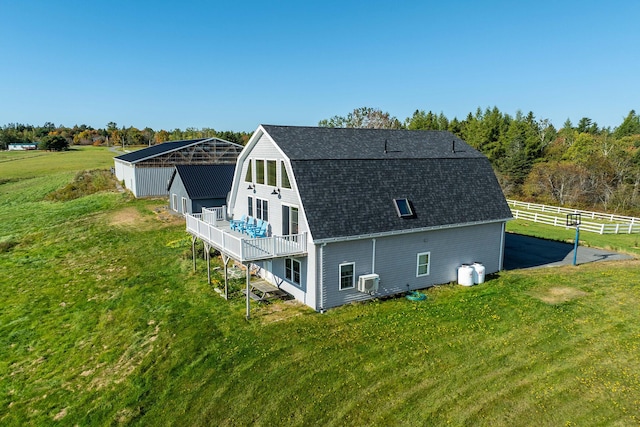 452 Milbridge Rd, Cherryfield, ME 04622 - rear view of property featuring a gambrel roof, roof with shingles, and a yard