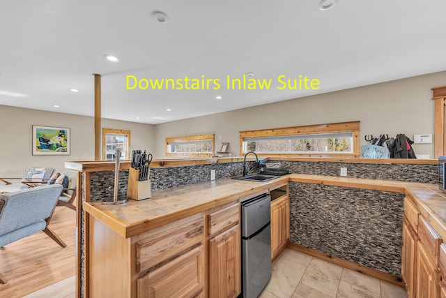 452 Milbridge Rd, Cherryfield, ME 04622 - kitchen with a sink, freestanding refrigerator, open floor plan, tile countertops, and recessed lighting
