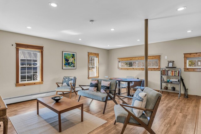 452 Milbridge Rd, Cherryfield, ME 04622 - living room with a baseboard radiator, light wood-style flooring, recessed lighting, and a wealth of natural light