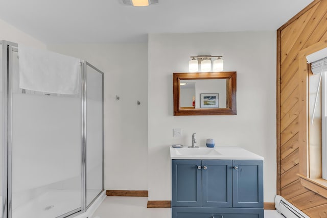 452 Milbridge Rd, Cherryfield, ME 04622 - bathroom with a stall shower, a baseboard radiator, baseboards, and vanity