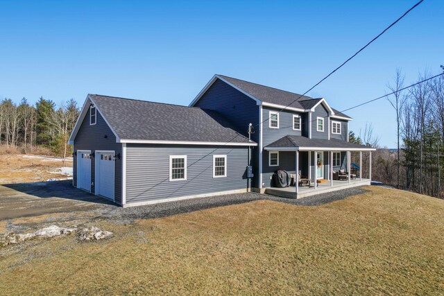 63 Grandview Dr, Newport, ME 04953 - back of property with a porch, an attached garage, roof with shingles, and a yard