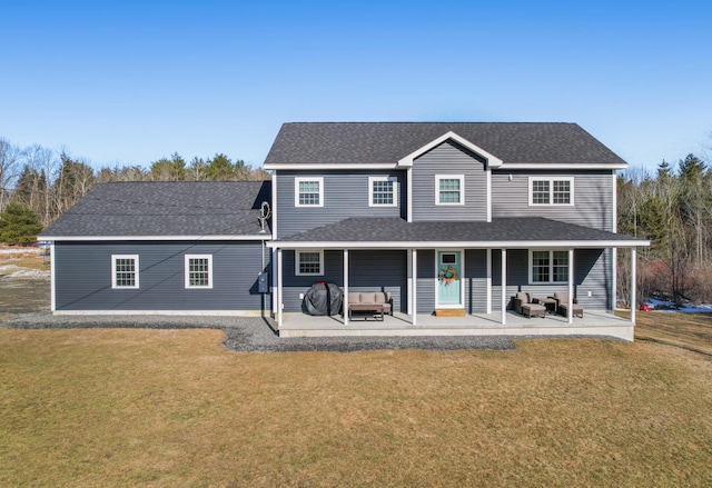 63 Grandview Dr, Newport, ME 04953 - view of front of property featuring a patio area, a front lawn, outdoor lounge area, and roof with shingles