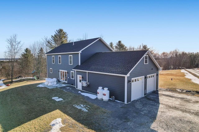 63 Grandview Dr, Newport, ME 04953 - exterior space featuring a garage, a yard, and a shingled roof