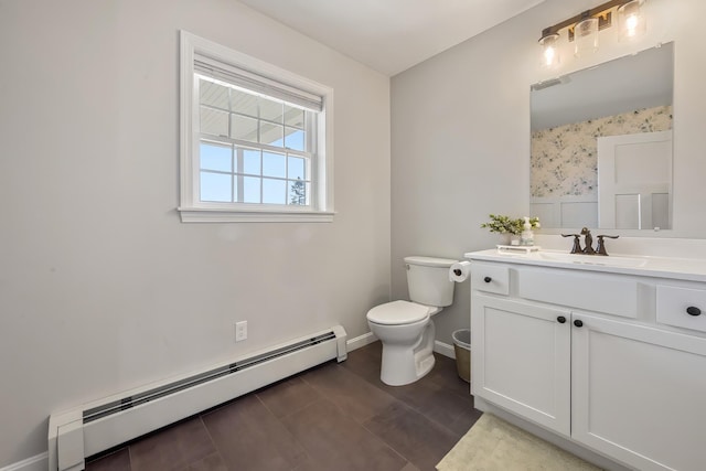 63 Grandview Dr, Newport, ME 04953 - bathroom featuring visible vents, toilet, vanity, baseboards, and baseboard heating