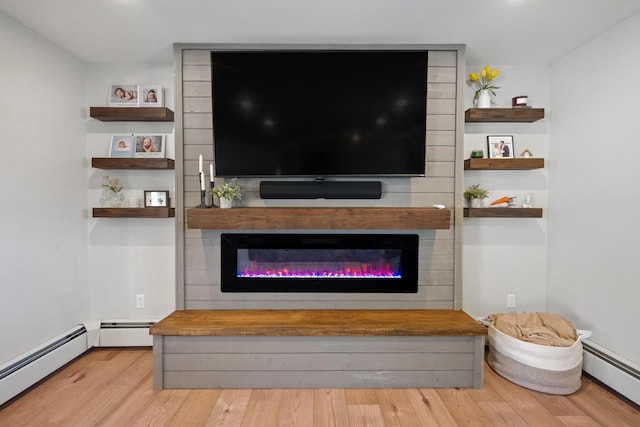 63 Grandview Dr, Newport, ME 04953 - living room with a baseboard radiator, wood finished floors, and a fireplace