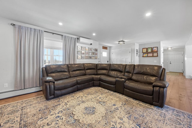 63 Grandview Dr, Newport, ME 04953 - living room featuring recessed lighting, wood finished floors, a wall unit AC, and baseboard heating