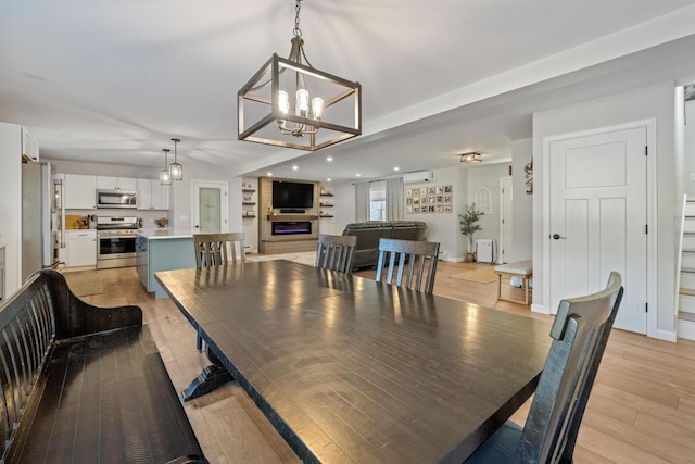 63 Grandview Dr, Newport, ME 04953 - dining room with a notable chandelier, light wood finished floors, and recessed lighting