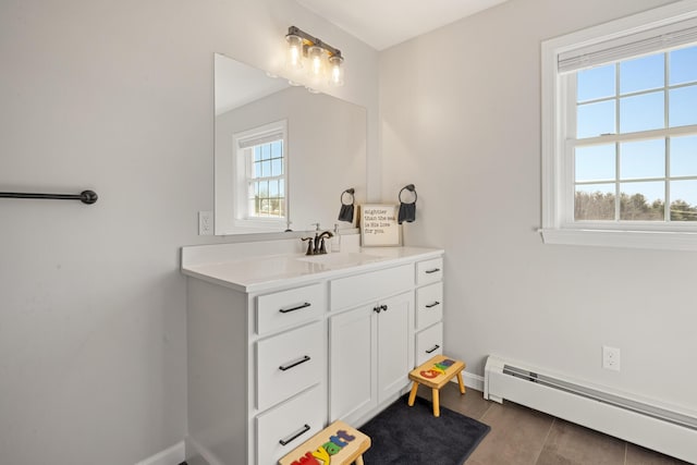 63 Grandview Dr, Newport, ME 04953 - bathroom featuring baseboard heating, baseboards, and vanity