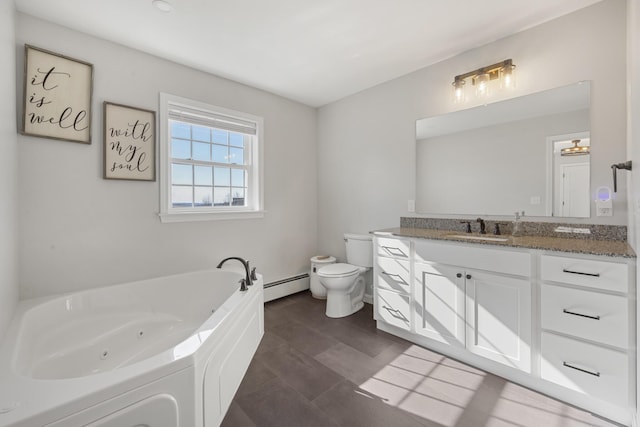 63 Grandview Dr, Newport, ME 04953 - full bathroom featuring baseboard heating, toilet, vanity, and a jetted tub