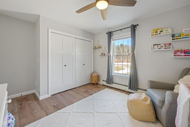 63 Grandview Dr, Newport, ME 04953 - sitting room featuring a baseboard heating unit, baseboards, wood finished floors, and ceiling fan