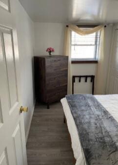 bedroom featuring wood finished floors