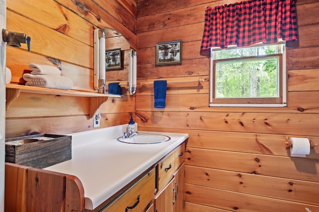 62 Hernborg Rd, Rangeley, ME 04970 - bathroom featuring wood walls and vanity