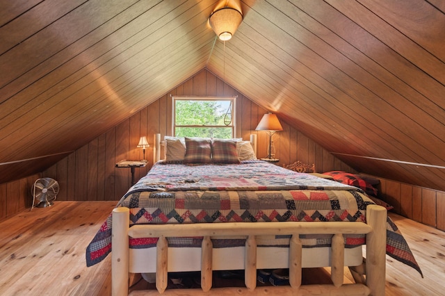 62 Hernborg Rd, Rangeley, ME 04970 - bedroom with wood walls, lofted ceiling, hardwood / wood-style flooring, and wooden ceiling