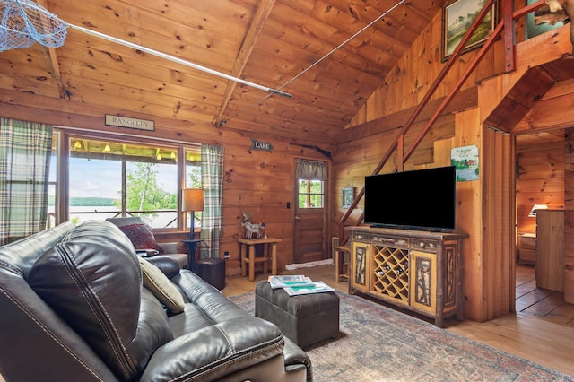 62 Hernborg Rd, Rangeley, ME 04970 - living area featuring lofted ceiling, wood ceiling, wooden walls, and wood finished floors