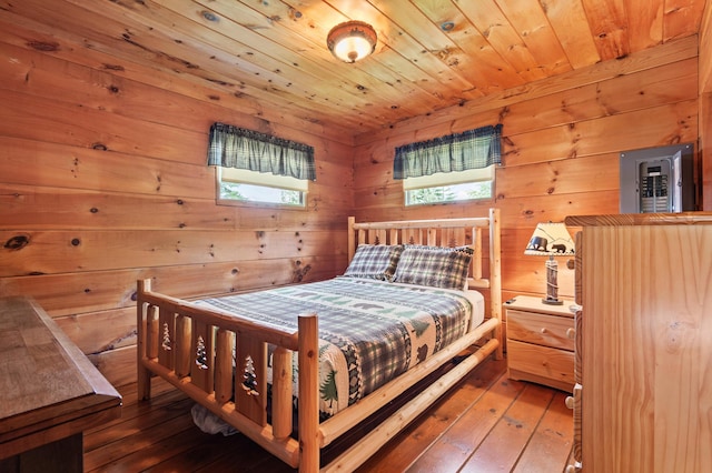 62 Hernborg Rd, Rangeley, ME 04970 - bedroom with hardwood / wood-style flooring, wood walls, and wood ceiling