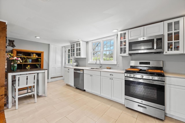 30 Joy Valley Rd, Buxton, ME 04093 - kitchen featuring stainless steel appliances, a sink, light countertops, white cabinets, and recessed lighting