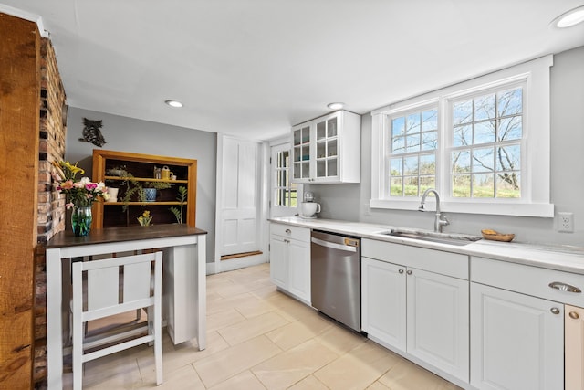 30 Joy Valley Rd, Buxton, ME 04093 - kitchen featuring dishwasher, a sink, light tile patterned floors, glass insert cabinets, and white cabinetry