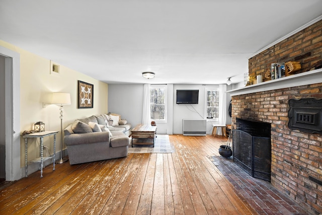 30 Joy Valley Rd, Buxton, ME 04093 - living area with hardwood / wood-style floors and a brick fireplace