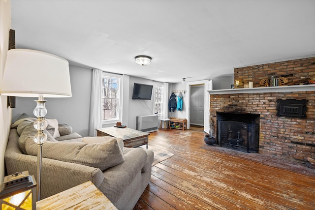 30 Joy Valley Rd, Buxton, ME 04093 - living room with wood-type flooring and a fireplace