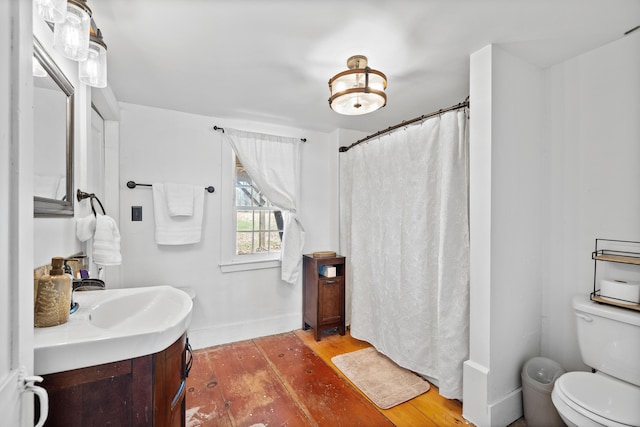 30 Joy Valley Rd, Buxton, ME 04093 - bathroom with toilet, hardwood / wood-style floors, vanity, a shower with shower curtain, and baseboards