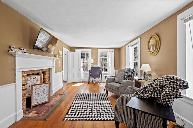 30 Joy Valley Rd, Buxton, ME 04093 - living room with wood-type flooring and a fireplace with flush hearth