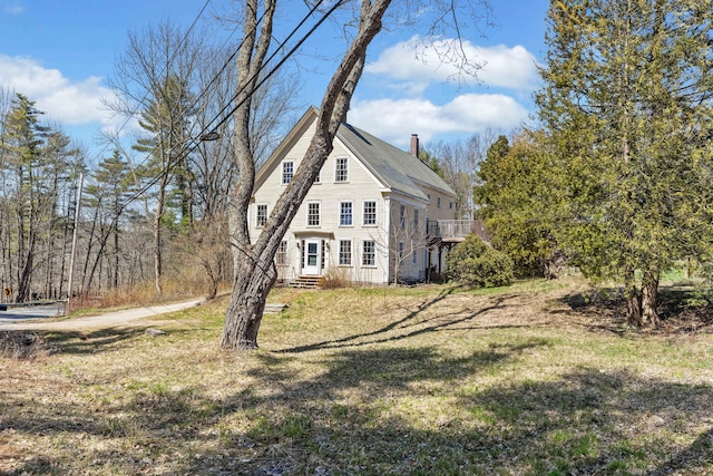 30 Joy Valley Rd, Buxton, ME 04093 - view of home's exterior with a chimney and a yard