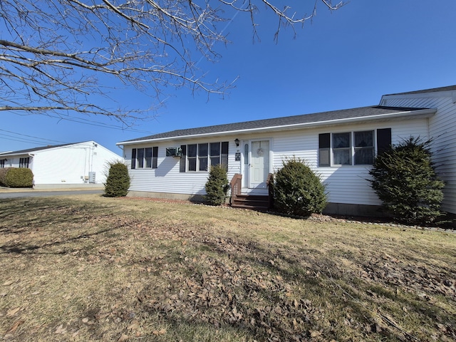 single story home featuring a front yard