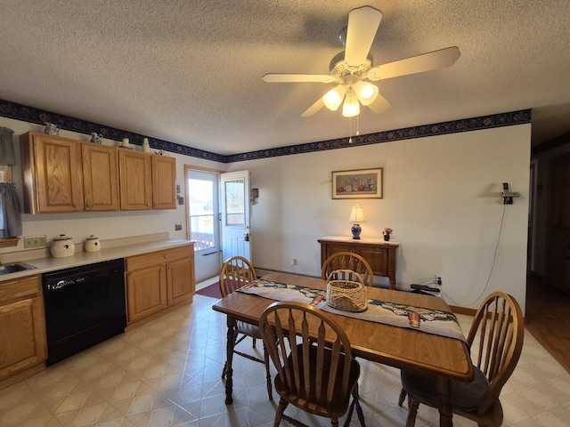 dining area featuring a textured ceiling, light floors, and a ceiling fan