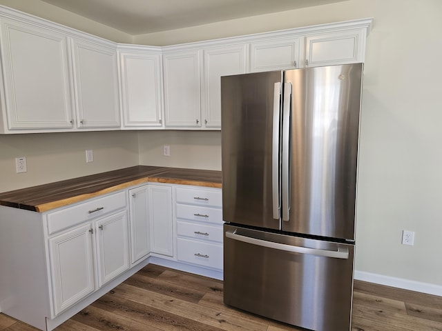 310 Emery Mills Rd, Shapleigh, ME 04076 - kitchen featuring freestanding refrigerator, wood counters, white cabinetry, and dark wood-style flooring