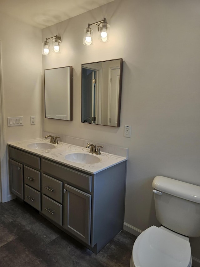 310 Emery Mills Rd, Shapleigh, ME 04076 - bathroom with double vanity and toilet