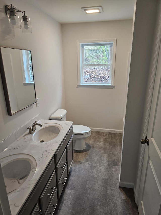 310 Emery Mills Rd, Shapleigh, ME 04076 - bathroom with double vanity and tile patterned floors