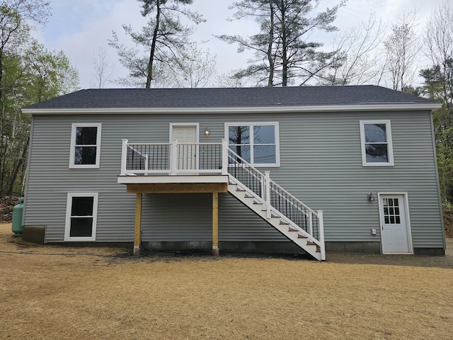 310 Emery Mills Rd, Shapleigh, ME 04076 - rear view of property featuring stairs, a deck, a shingled roof, and a lawn