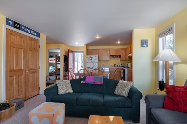 carpeted living room with recessed lighting