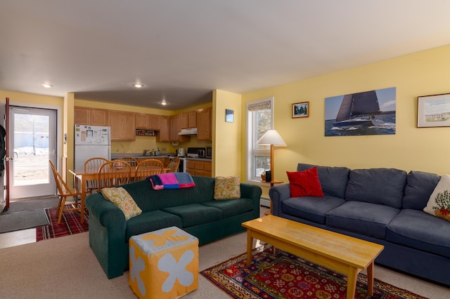 living room with recessed lighting and carpet