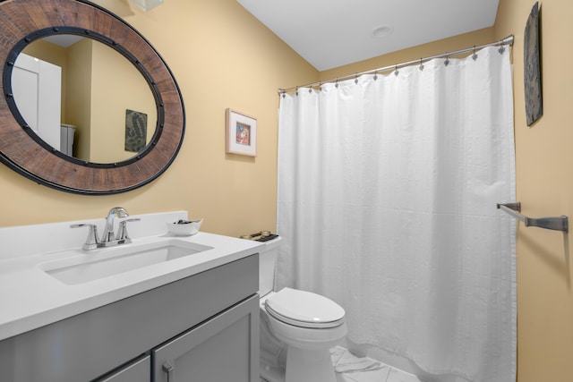 full bathroom featuring a shower with curtain, toilet, marble finish floor, and vanity