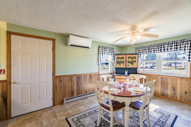 dining space featuring wooden walls, wainscoting, a wall unit AC, and a baseboard radiator