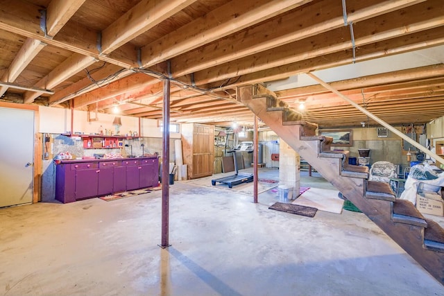 unfinished basement with stairs