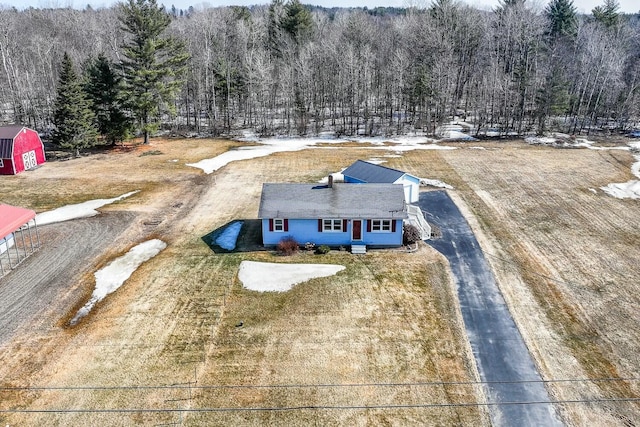 aerial view featuring a wooded view