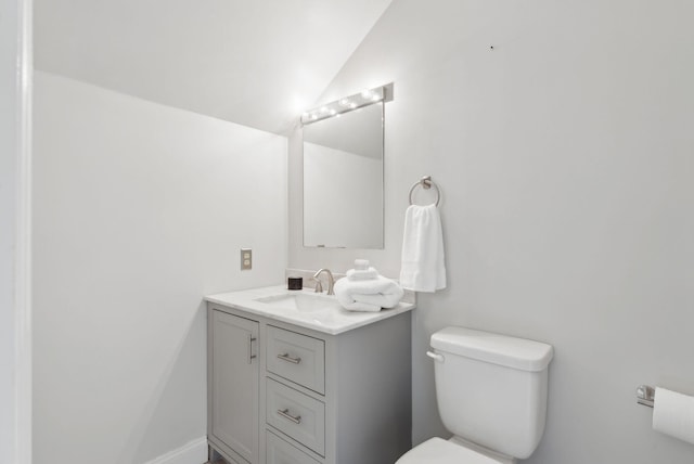 105 Chandlers Wharf Unit 105, Portland, ME 04101 - half bath with toilet, vanity, and vaulted ceiling